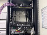 a wall mounted cabinet with a bunch of wires in it