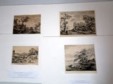 four framed pictures of a landscape with a river and a village