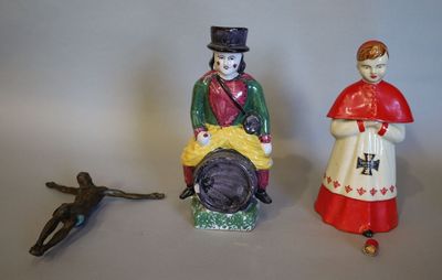 deux figurines d'un homme et d'une femme assis l'un à côté de l'autre