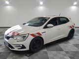 the white car is parked in the garage with a checkered floor