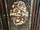 a wooden cabinet with a decorative design on it