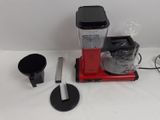 a blender that is sitting on a white table