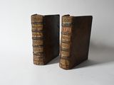pair of antique leather bookends on a white background