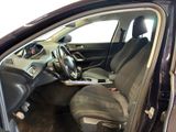 the interior of a car with the door open and the driver ' s seat down