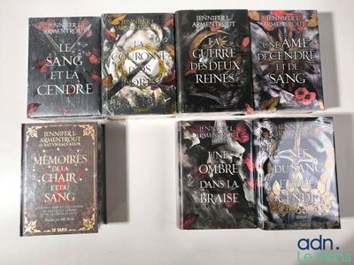 five books that are sitting on top of a table