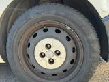 a white van that has a flat tire on it