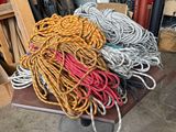 a pile of assorted items on a table in a garage