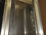 an image of a microwave with a comb inside of it