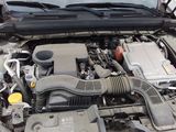 a car engine with its hood open and the hood down