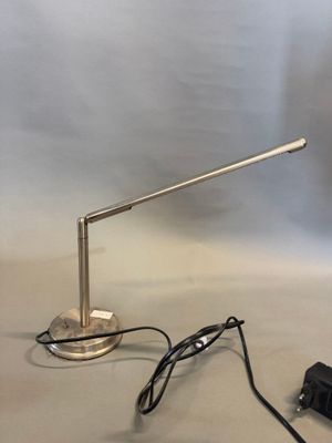 an image of a desk lamp and charger on a table