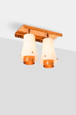 two lights that are on the ceiling in the room
