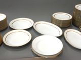a lot of plates that are sitting on a table