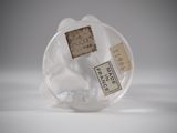 a clear plastic object with a label on it