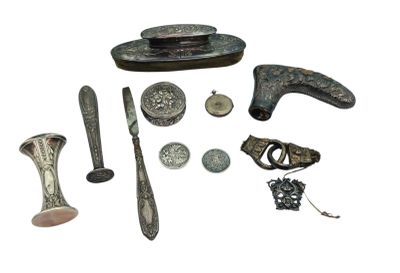 a lot of silver items that are on a white surface