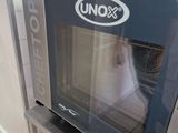a microwave sitting on top of a shelf in a kitchen