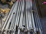 a pile of steel rods sitting on the ground