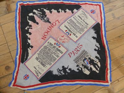 a picture of a world war ii scarf on a wooden floor