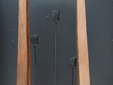 a wooden stand with a mirror on top of it