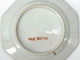 a white plate with a red writing on it