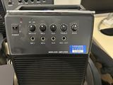 a radio sitting on top of a desk next to a laptop