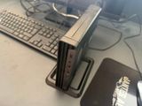 a computer sitting on a desk with a keyboard and mouse
