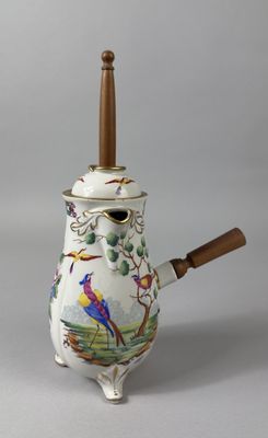 a tea pot with a wooden handle and a bird on it