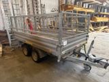 a trailer with a cage on the back of it in a warehouse