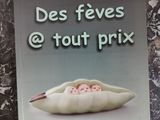 a book on a table with a picture of a food item on it