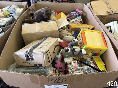a cardboard box filled with lots of toys in it