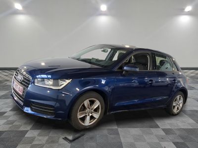 a picture of a blue car parked in a garage