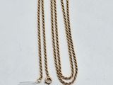 a gold chain with a tag that says $ 50 on it