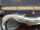 a silver pipe sticking out of a blue case