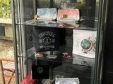 a glass case with many items inside of it