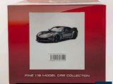 a box with a picture of a black car in it
