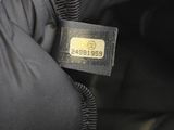 a close up of a person ' s hand holding a black purse