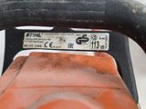 a close up of a chainsaw with a red handle