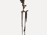 an image of a sculpture of a bird on a stand