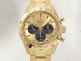 a gold watch with a black face on a white background