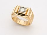 an image of a gold ring with a square diamond in the center