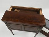 an old wooden desk with a mirror on top of it