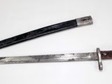 two different types of knives on a white surface