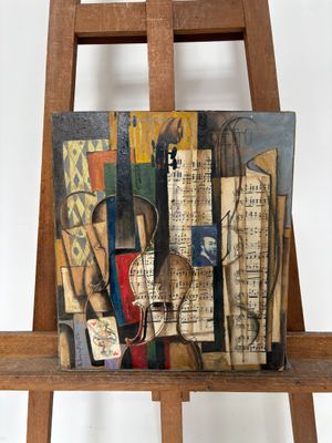 une photo d'un tableau posé sur un chevalet, avec des notes de musique