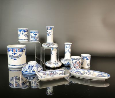 many blue and white dishes and cups on the table