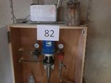 a picture of a small cabinet with a sign on it