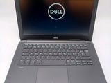 the dell laptop is open and ready to be used