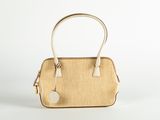 an image of a beige and white handbag on a white background