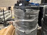 many rolls of plastic wrapped around a large machine