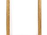 a gold frame on a white wall with a white background