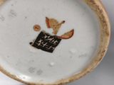 a small plate with a picture of a cat on it