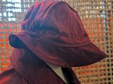 a red hat that is on a mannequin head